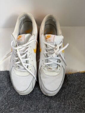 Nike Air Max White Sneakers with Yellow Swoosh Accents